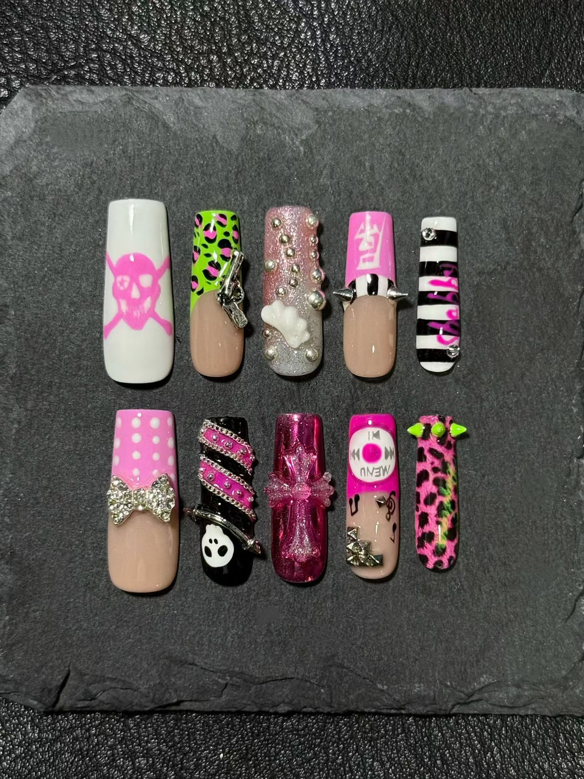 Original press-on nails featuring a Y2K-inspired retro style with leopard print and studs