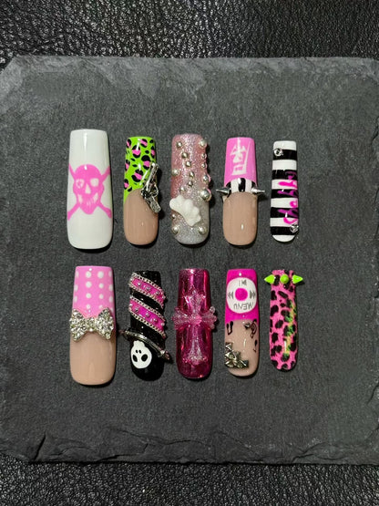 Original press-on nails featuring a Y2K-inspired retro style with leopard print and studs