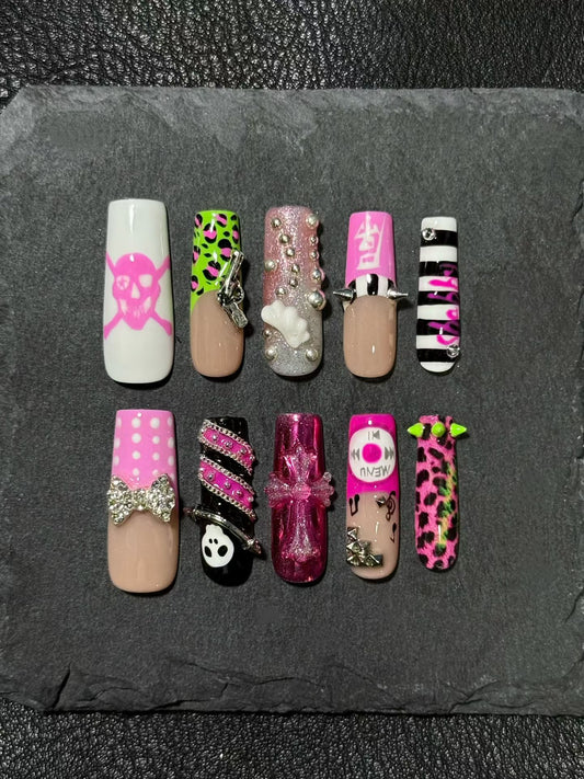 Original press-on nails featuring a Y2K-inspired retro style with leopard print and studs